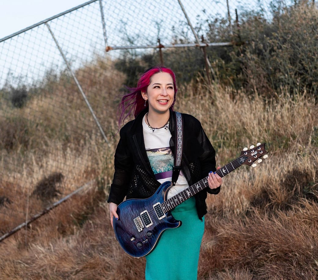 Nao Luka, of Jiinto Daybreak, with her electric guitar.